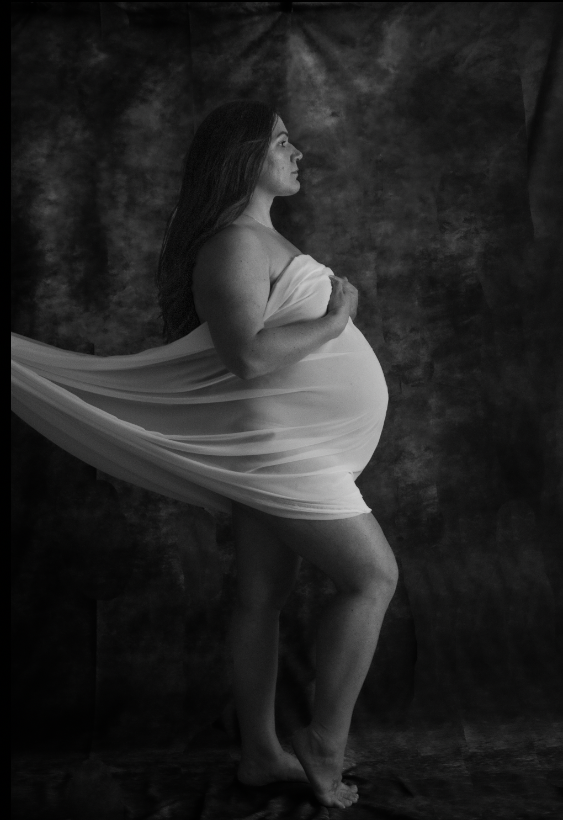 black and white photo of a pregnant women created by tyeasha elizabeth's portrait studio