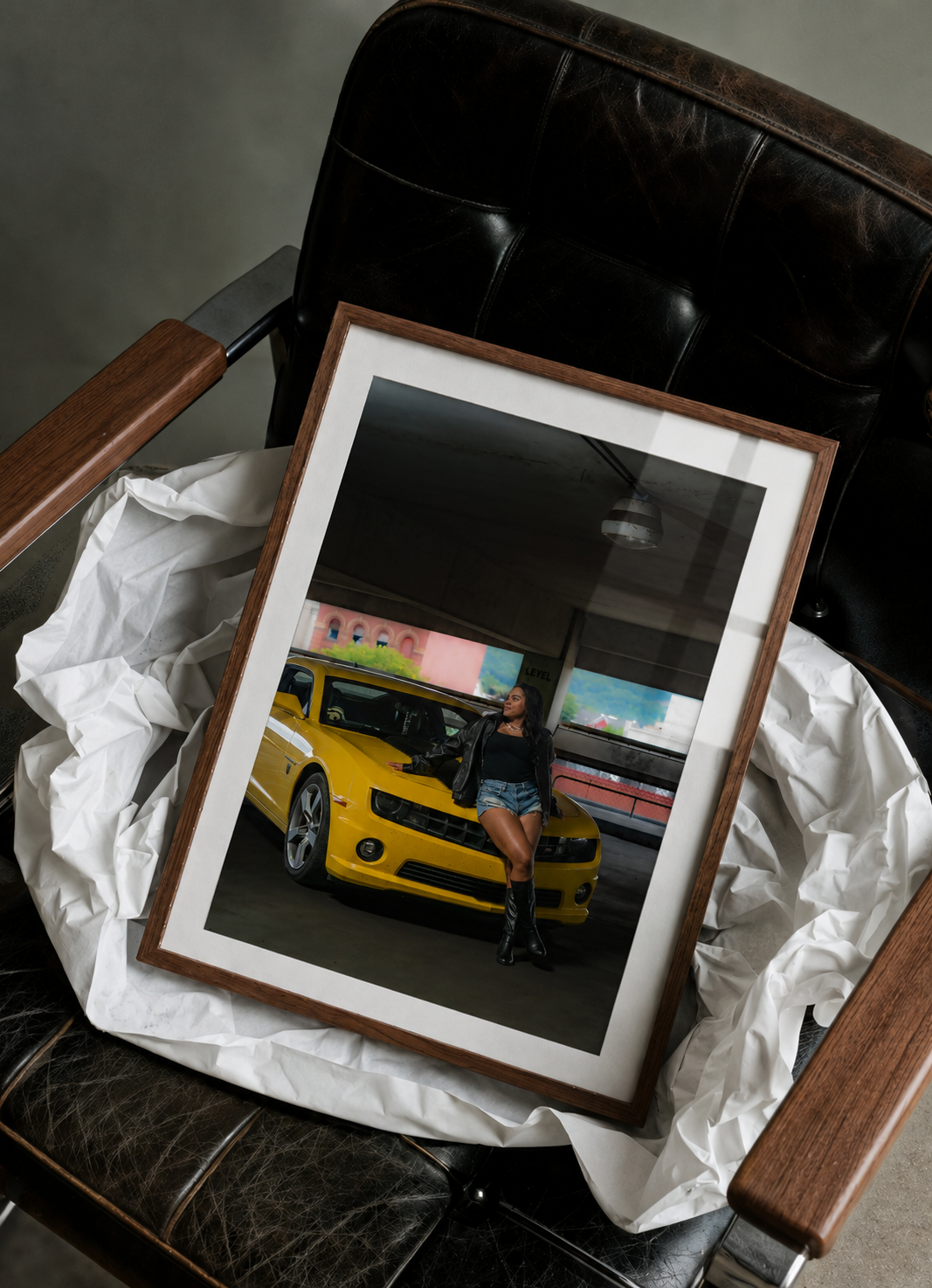 unwrapped framed editorial images of a woman and her car at the elmira ny parking garage near the lecom event center and clemens center
