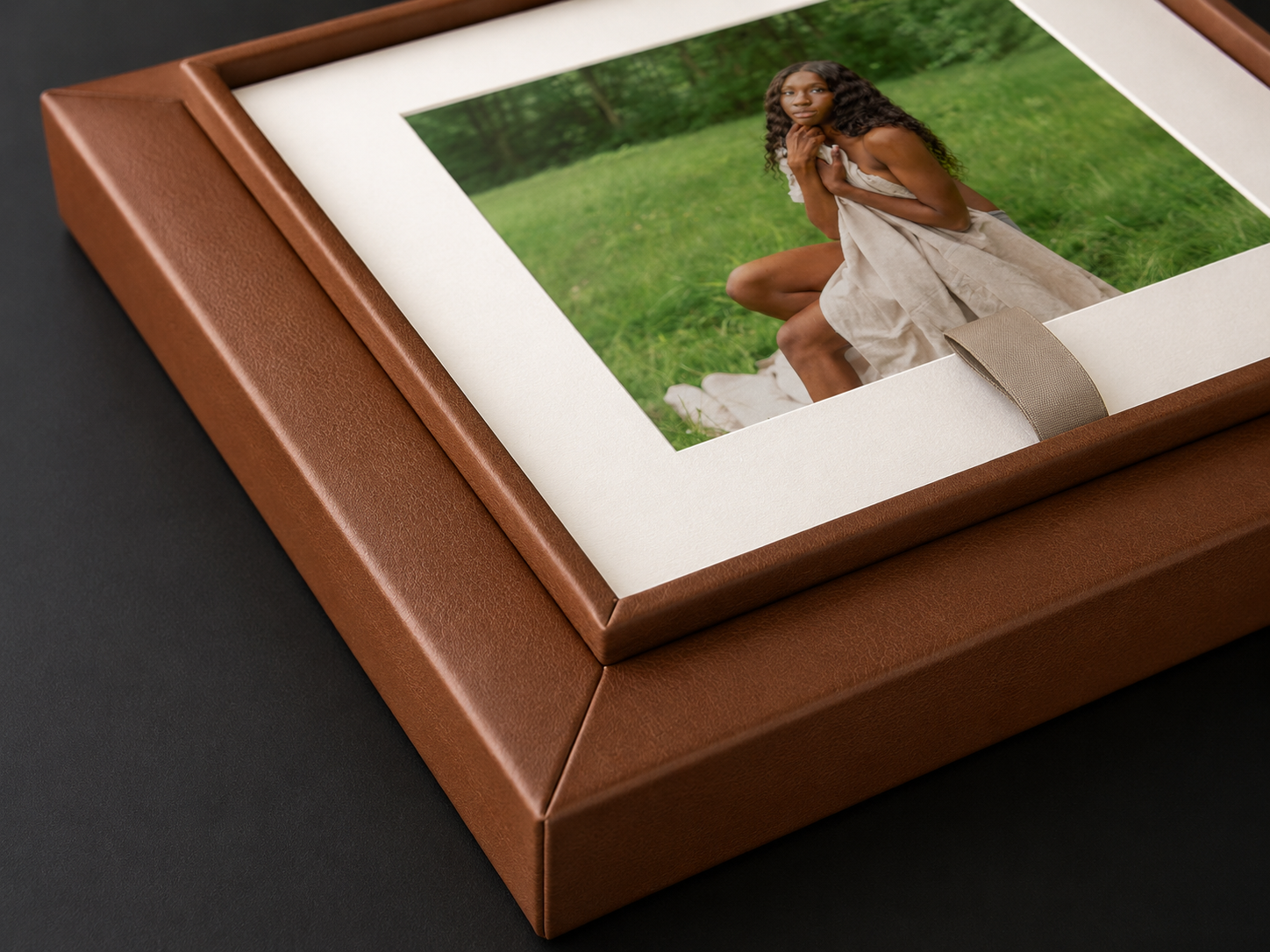 Leather portrait reveal box holding professionally printed beauty portraits