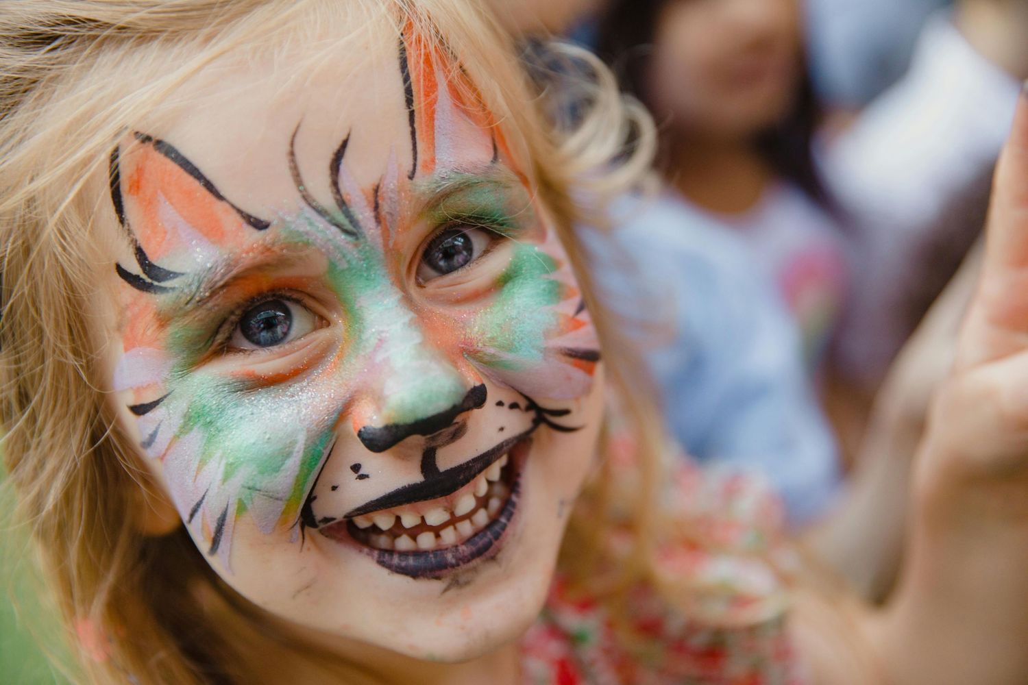 little girl with her make up and face paint at the market