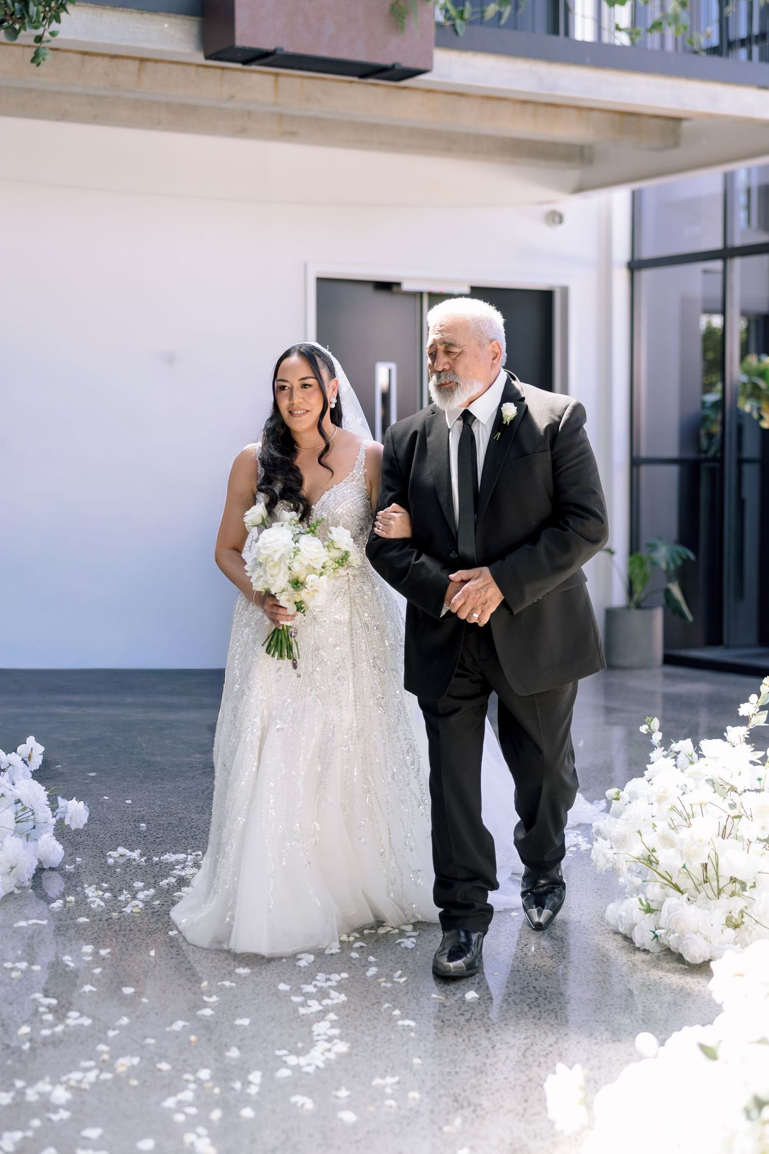 Bride walking down the aisle with her father, Hawke's Bay wedding photographer