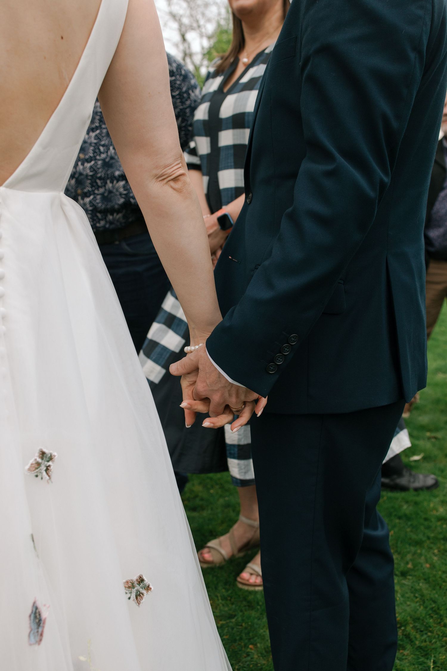 Hands held during a quiet ceremonial moment — kaupapa Māori wedding photography Hawke's Bay