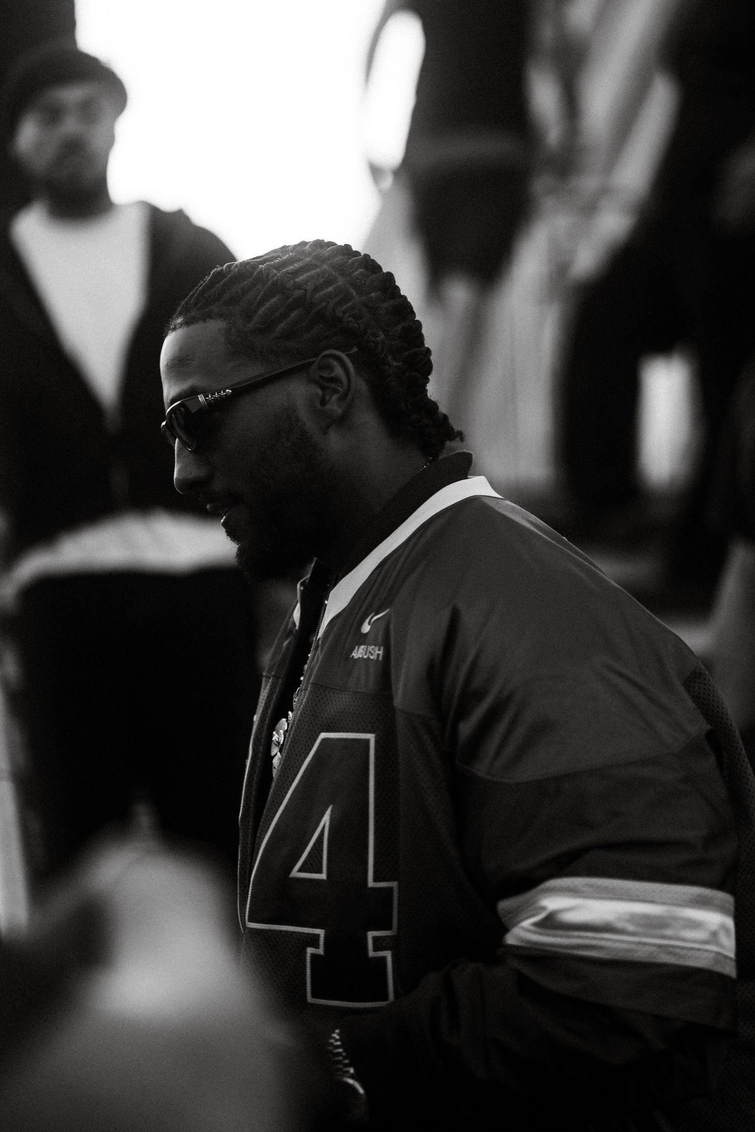 Reezy wearing jersey number 4 captured in black and white profile shot.
