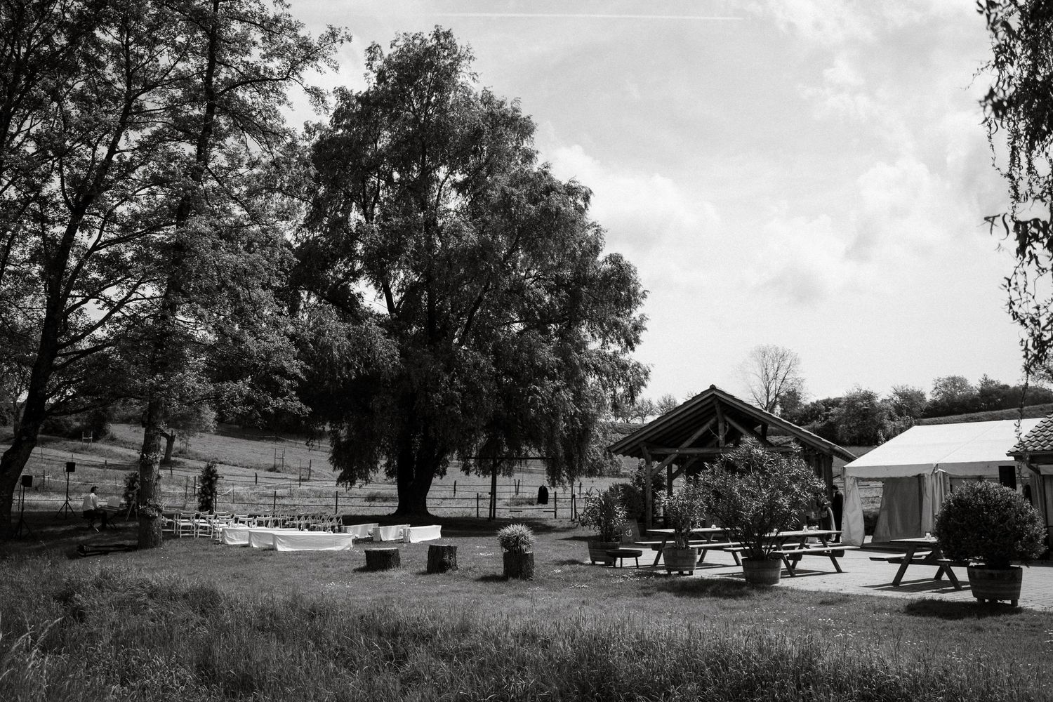 Rural landscape with trees and buildings stretching across a panoramic countryside view.