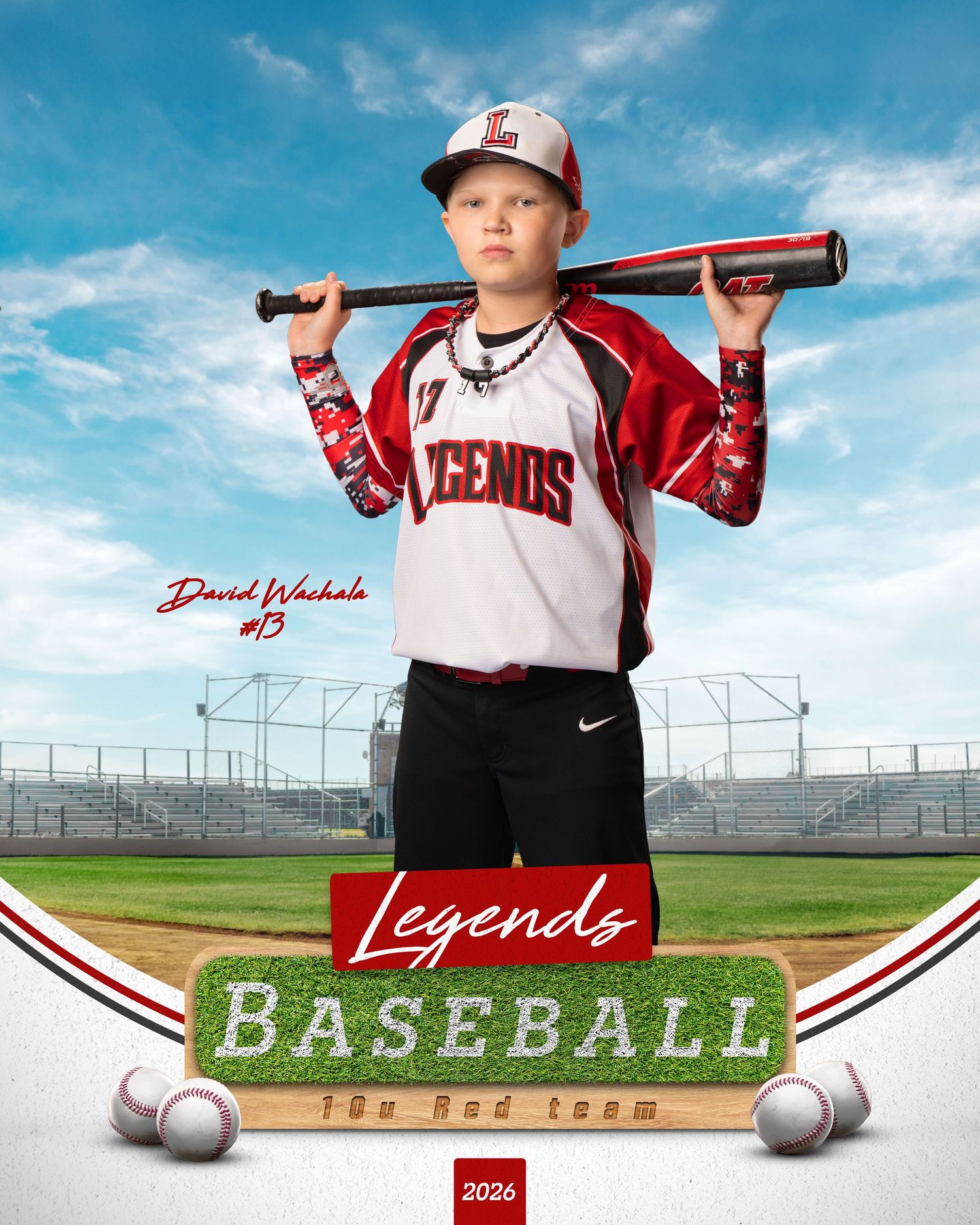 Youth baseball player poses with bat on shoulder against stadium backdrop in sports portrait style photography.