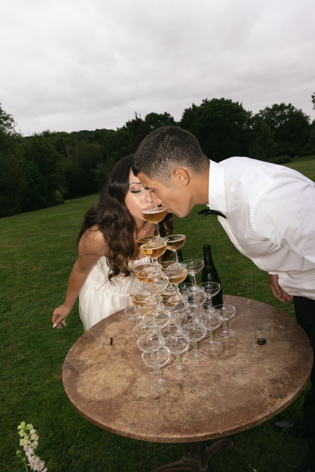 Modern wedding portrait using on-camera flash for a clean, editorial aesthetic during a luxury celebration.