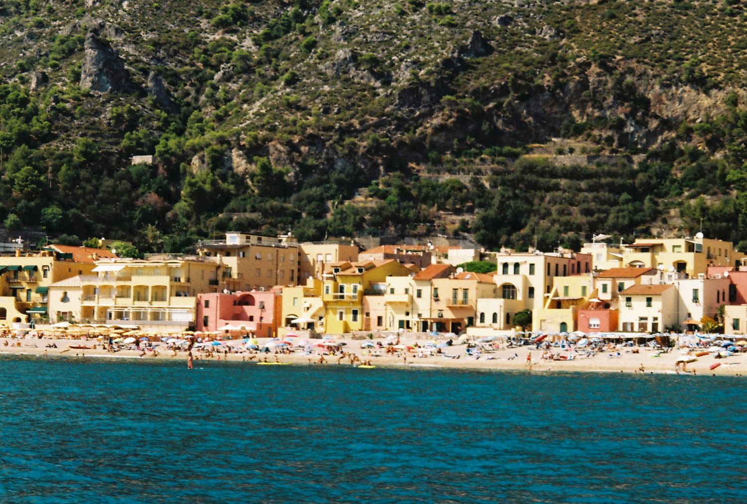 Colorful seaside village in Liguria captured on film, highlighting the charm of Italian Riviera wedding destinations.