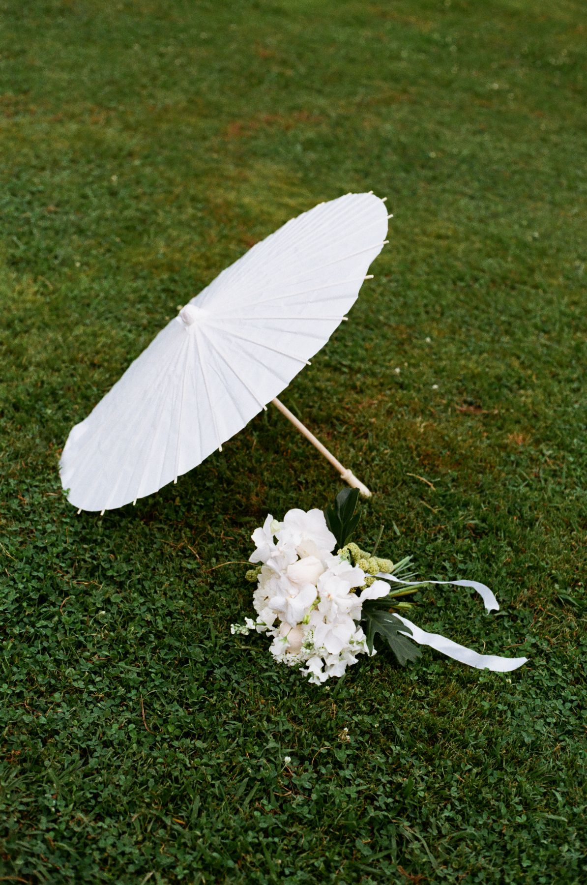 Detail shot highlighting florals, textures, and design elements in a loose editorial wedding style.