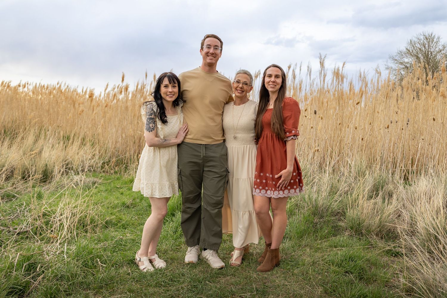 a mom and her adult kids posing for fall family photos in salt lake city utah