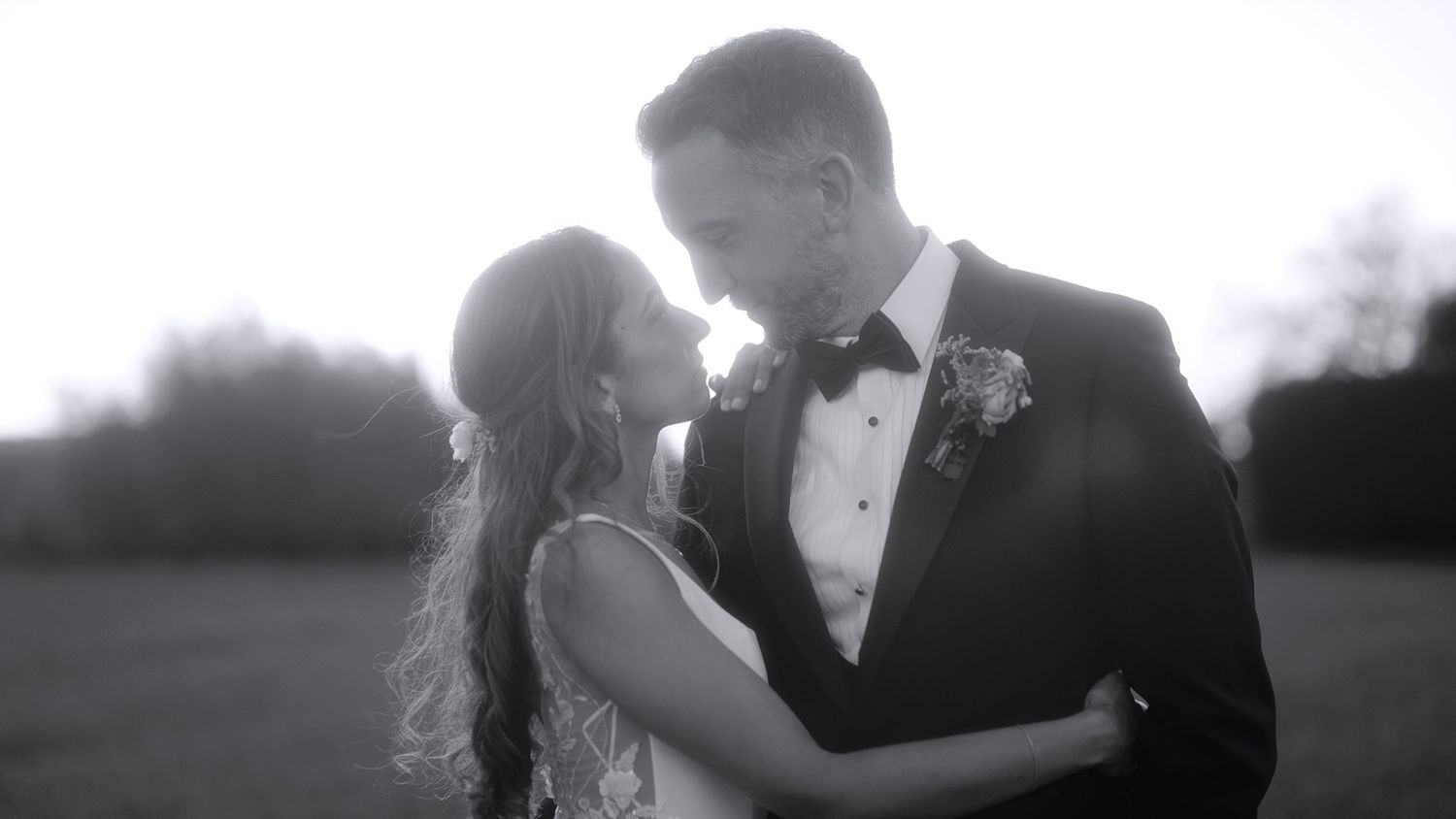 Black and white outdoor portrait sequence showing tender moments between two people.