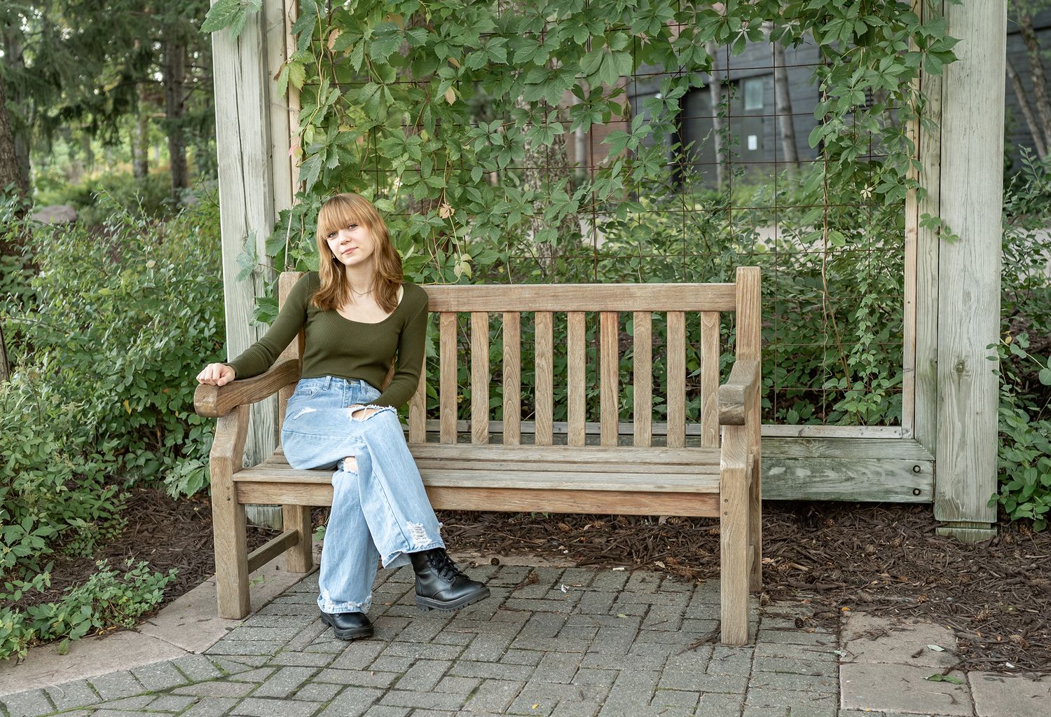 senior girl sitting on bench