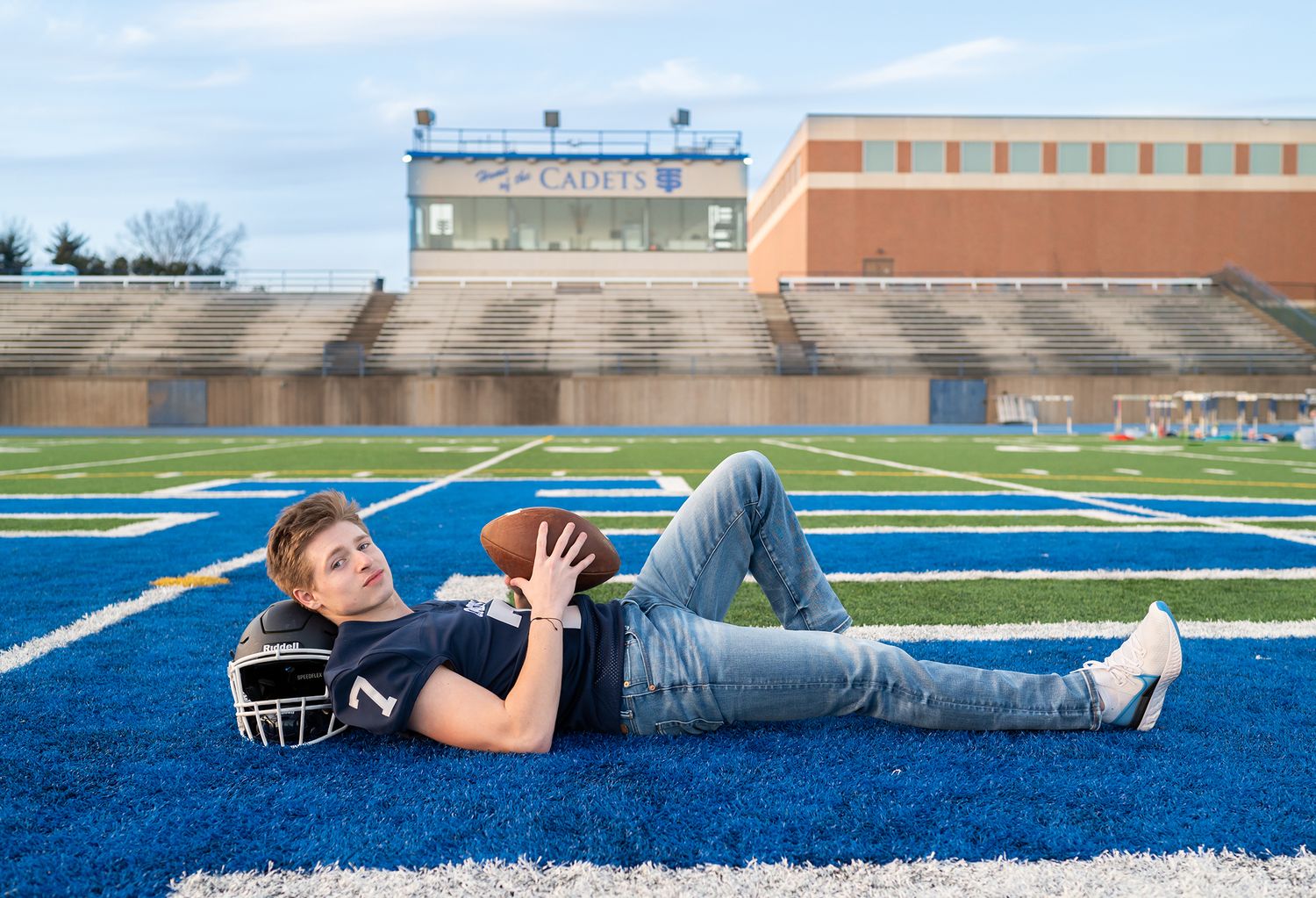 high school senior boy football stadium