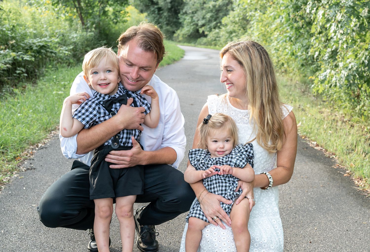 kids snuggling with mom and dad