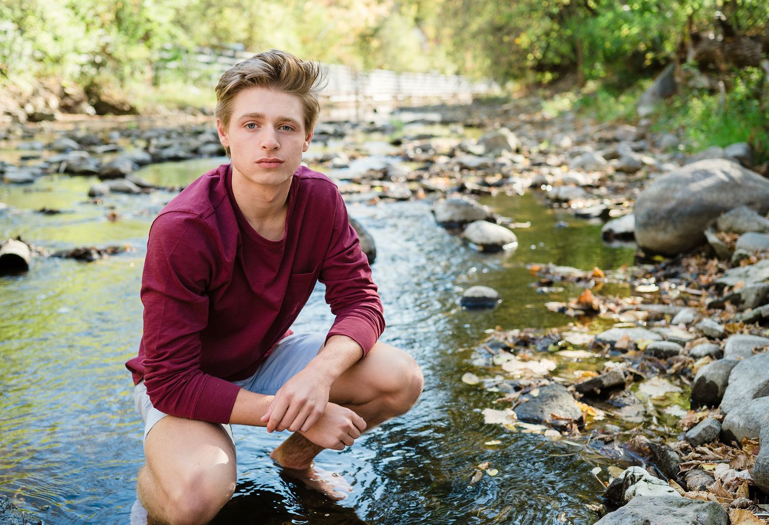 senior boy in creek