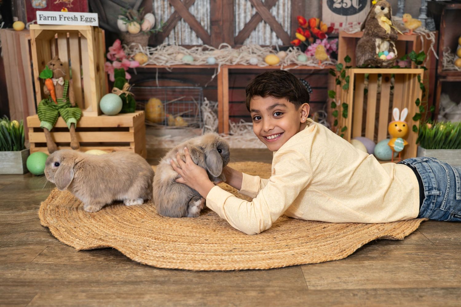 A person lounges on a large round woven rattan floor cushion surrounded by decorative home furnishings and plants.