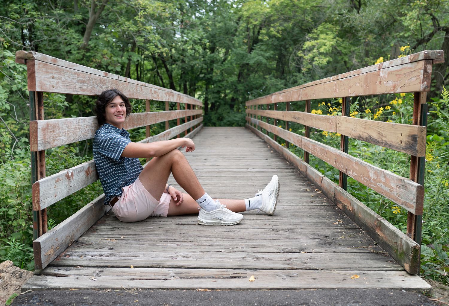 senior boy on bridge
