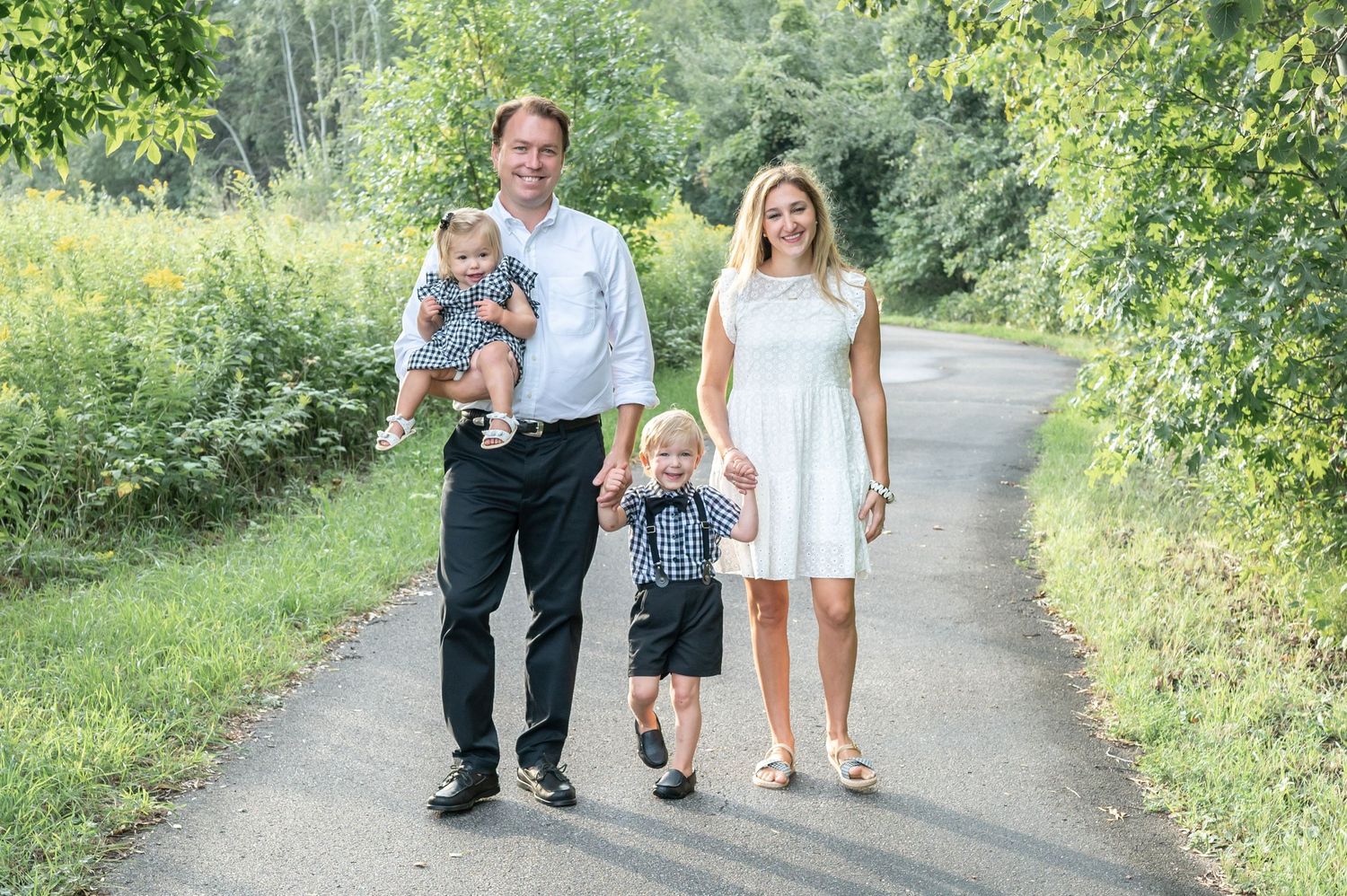 family walking down a path