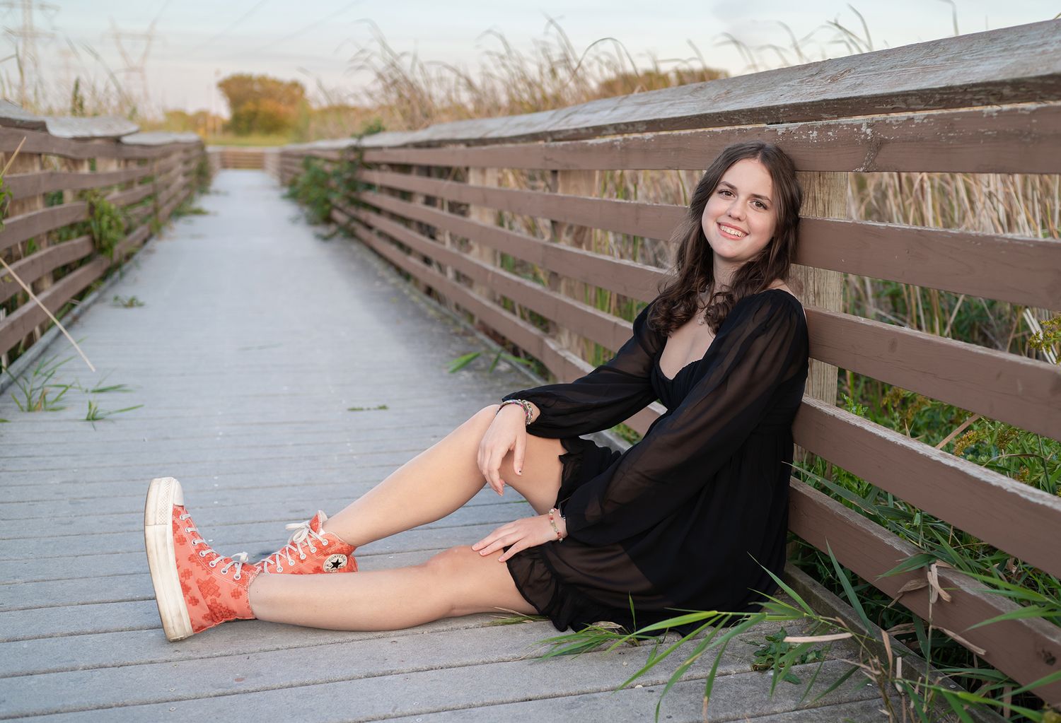 senior girl on boardwalk