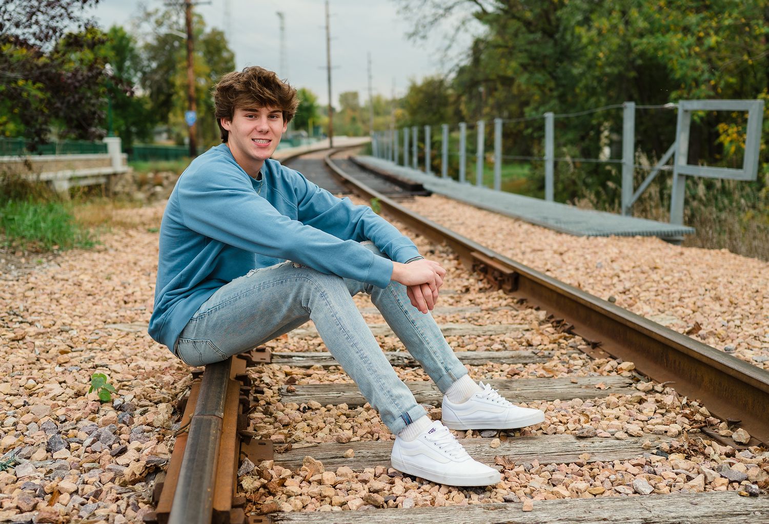 senior boy railroad tracks