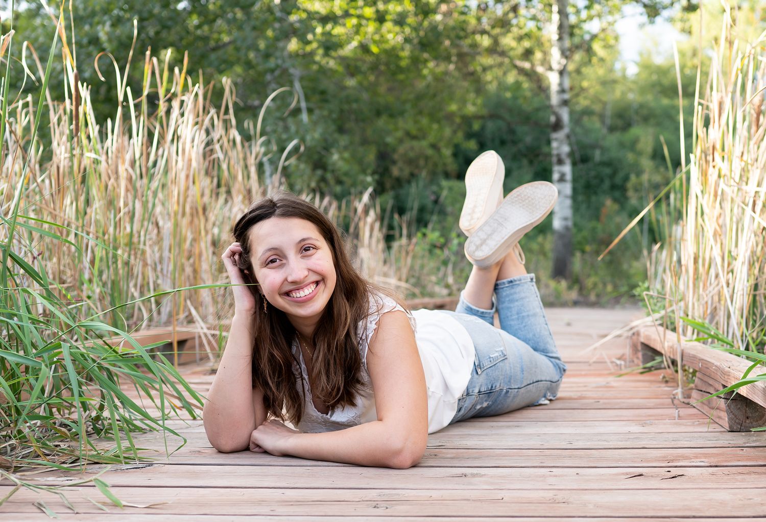 senior girl on boardwalk