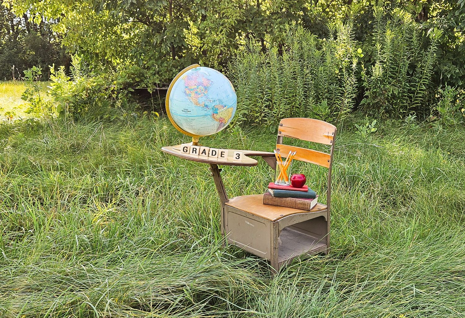 back to school desk blocks globe books