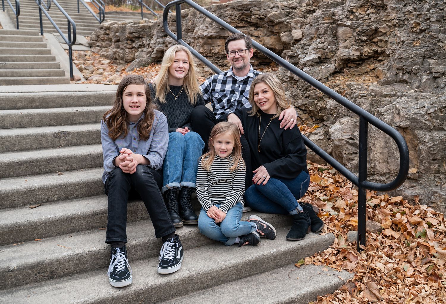 family sitting on stairs