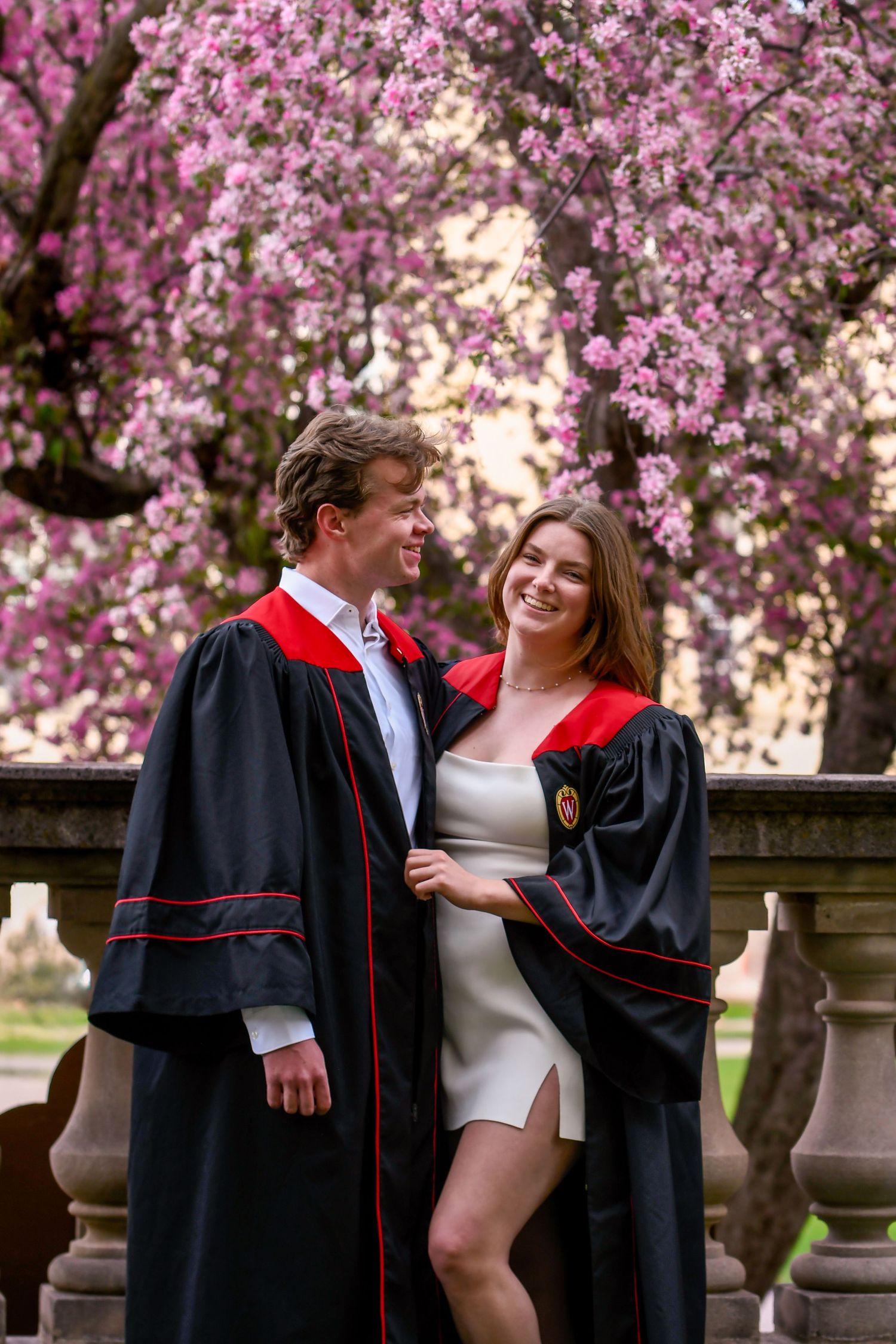 Couple in front of floral tree