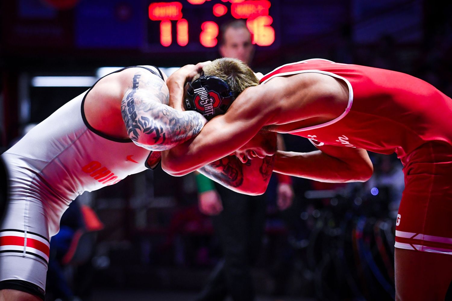 Wrestlers lock arms and go head to head