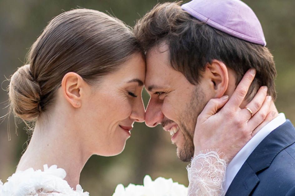 Romantic couple in wedding attire share intimate moments in a series of outdoor portraits.