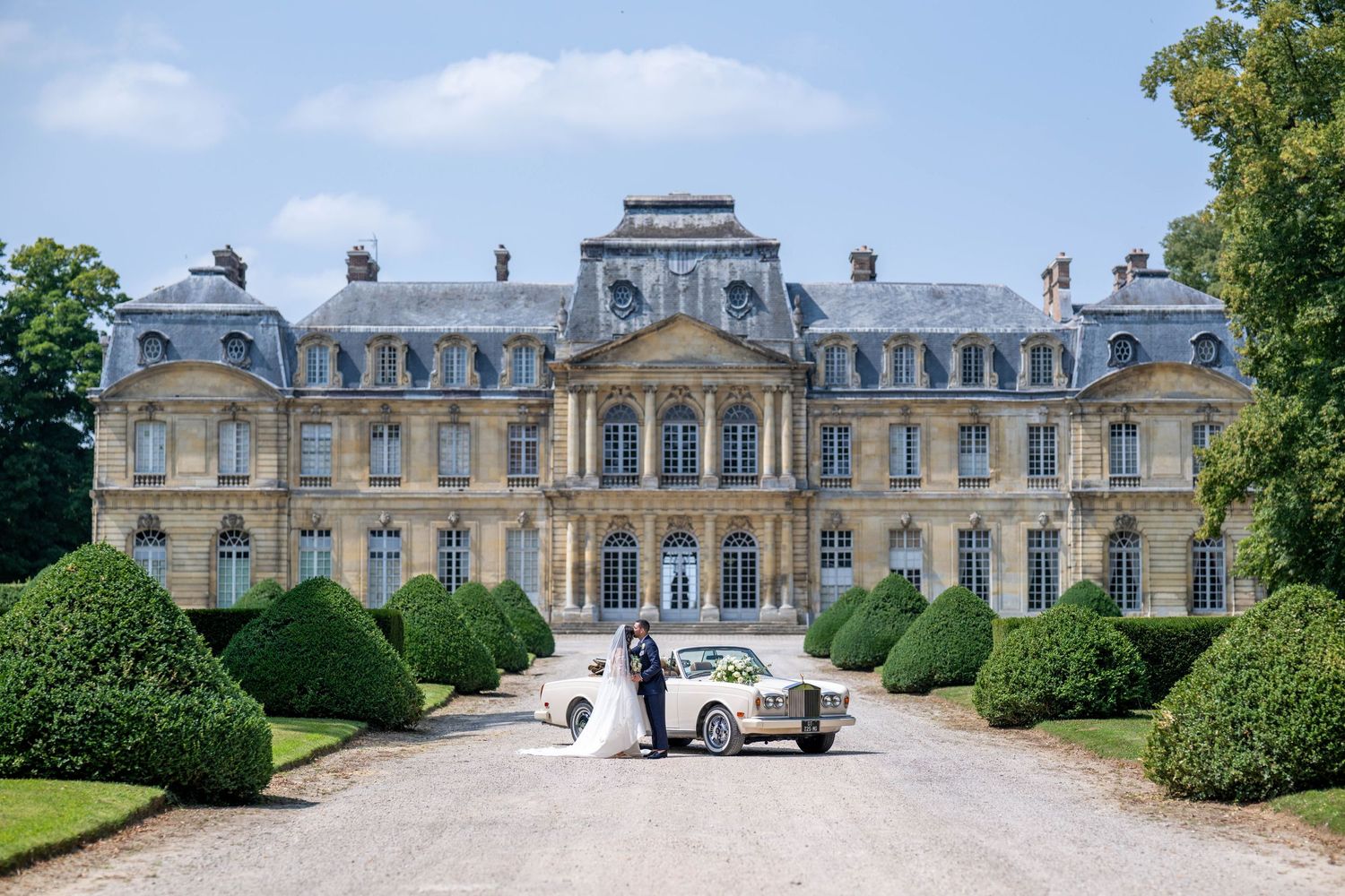 A panoramic collage of five views showing the elegant exterior and manicured gardens of a grand French chateau.