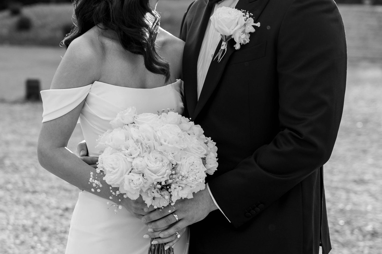 A romantic black and white wedding photo series showing close-up moments between a bride and groom.