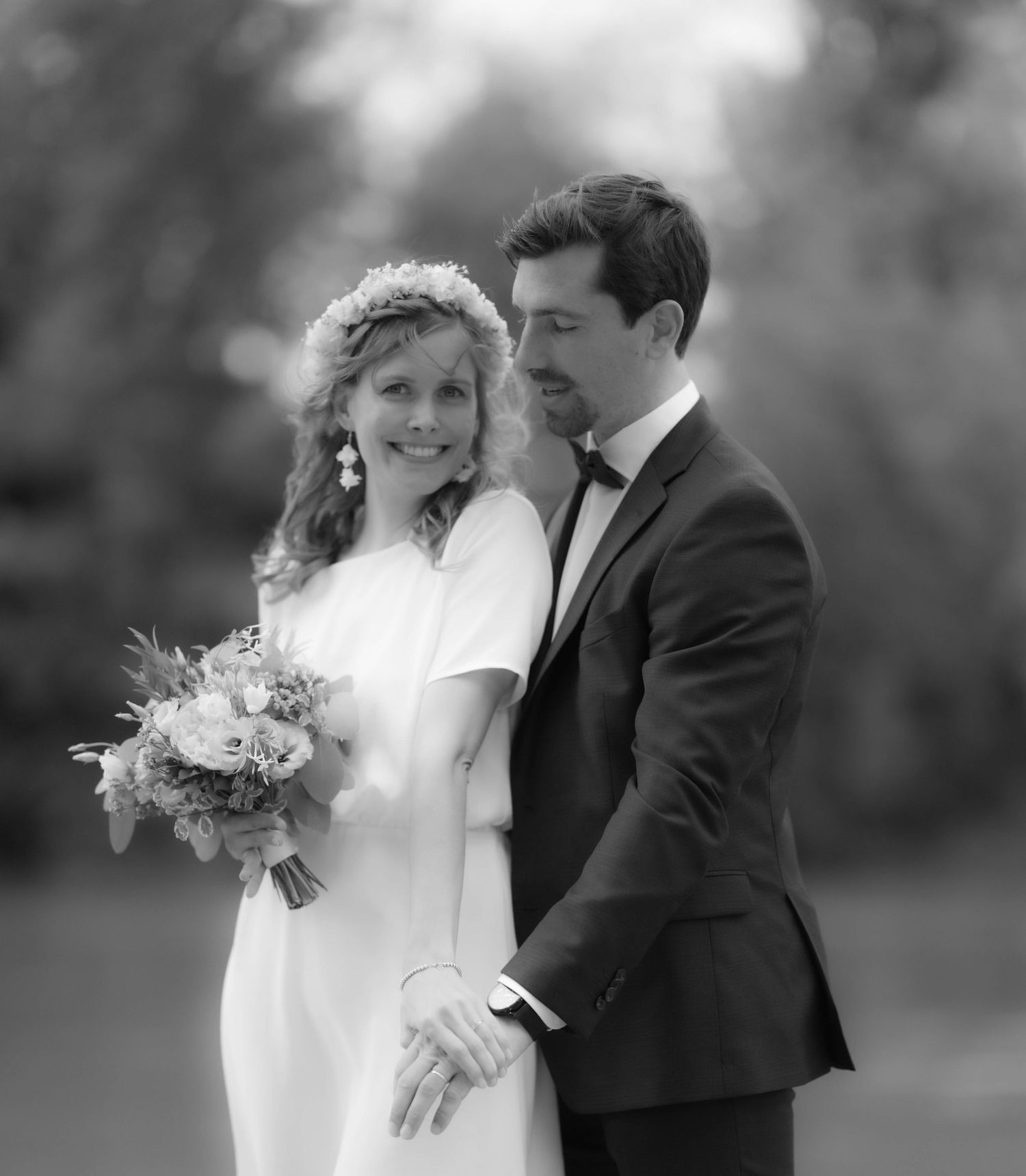 Romantic black and white wedding portrait with soft natural lighting.