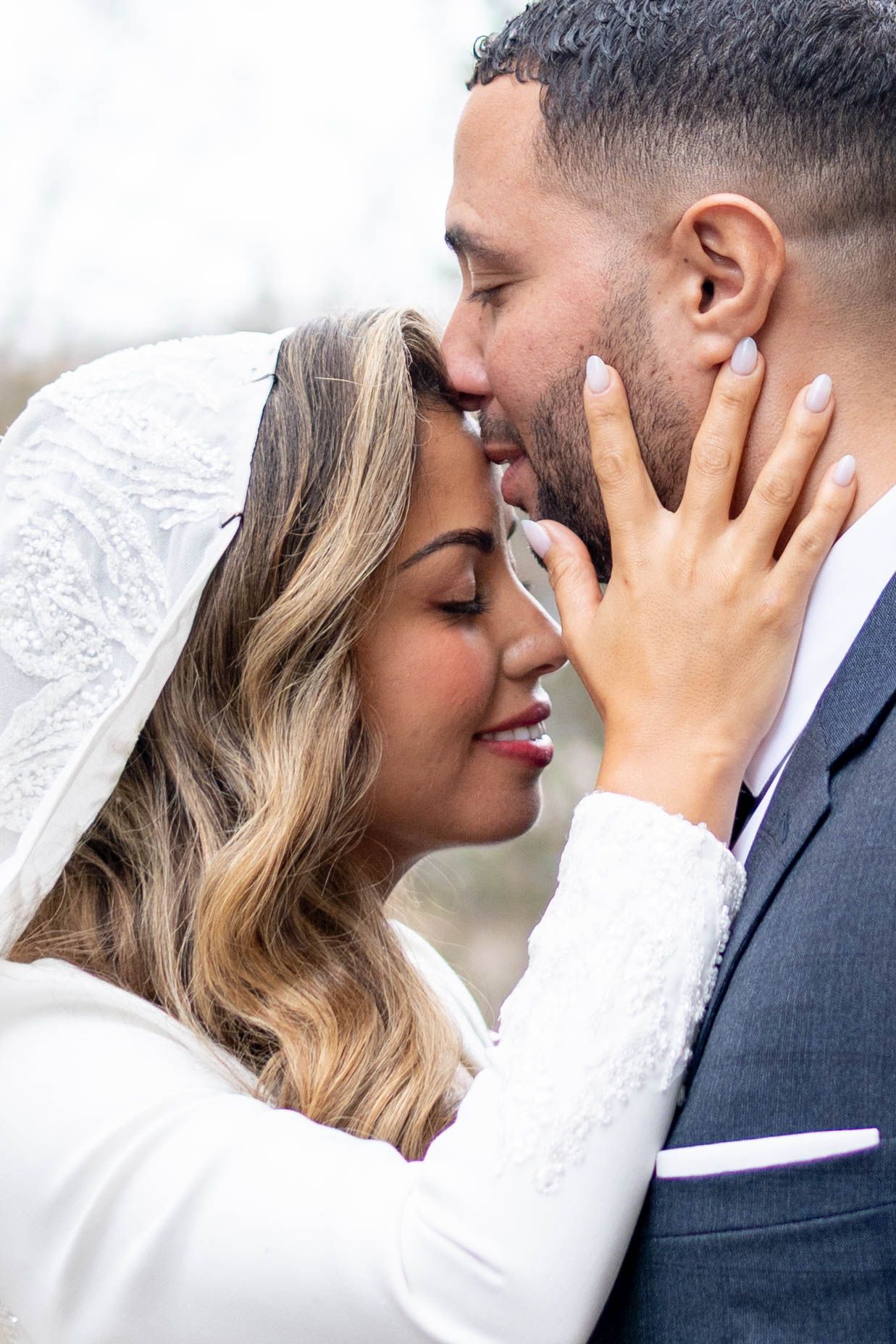 A romantic series of wedding photos showing close-up intimate moments between a couple in formal attire.