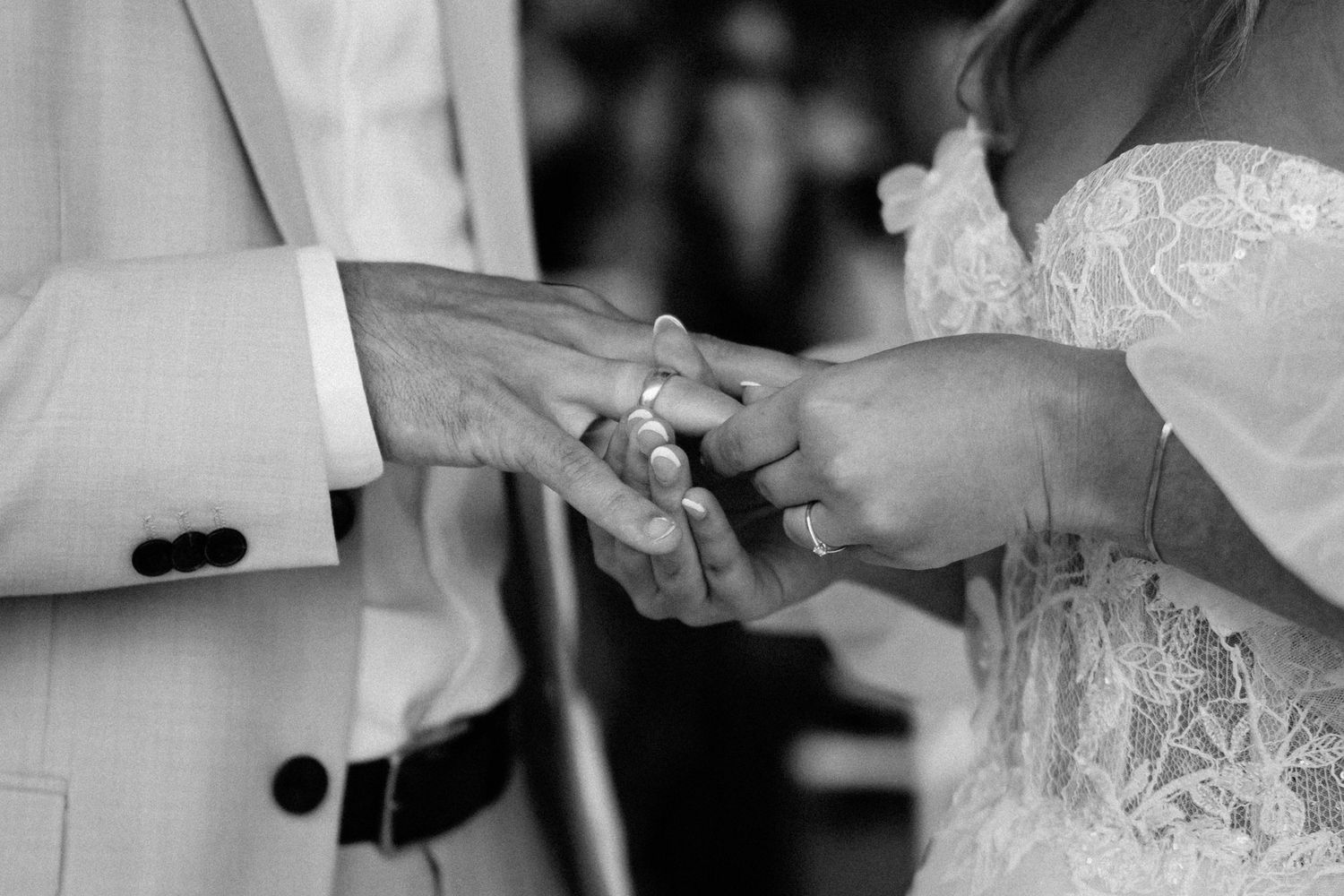 Black and white detail shots of wedding dress and formal attire.