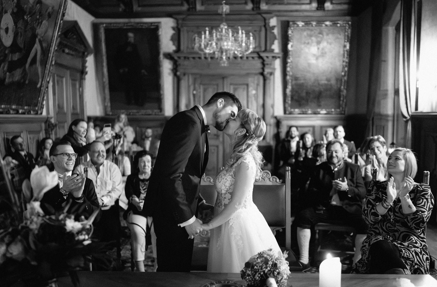 Wedding celebration in a rustic venue with warm lighting and wooden details.