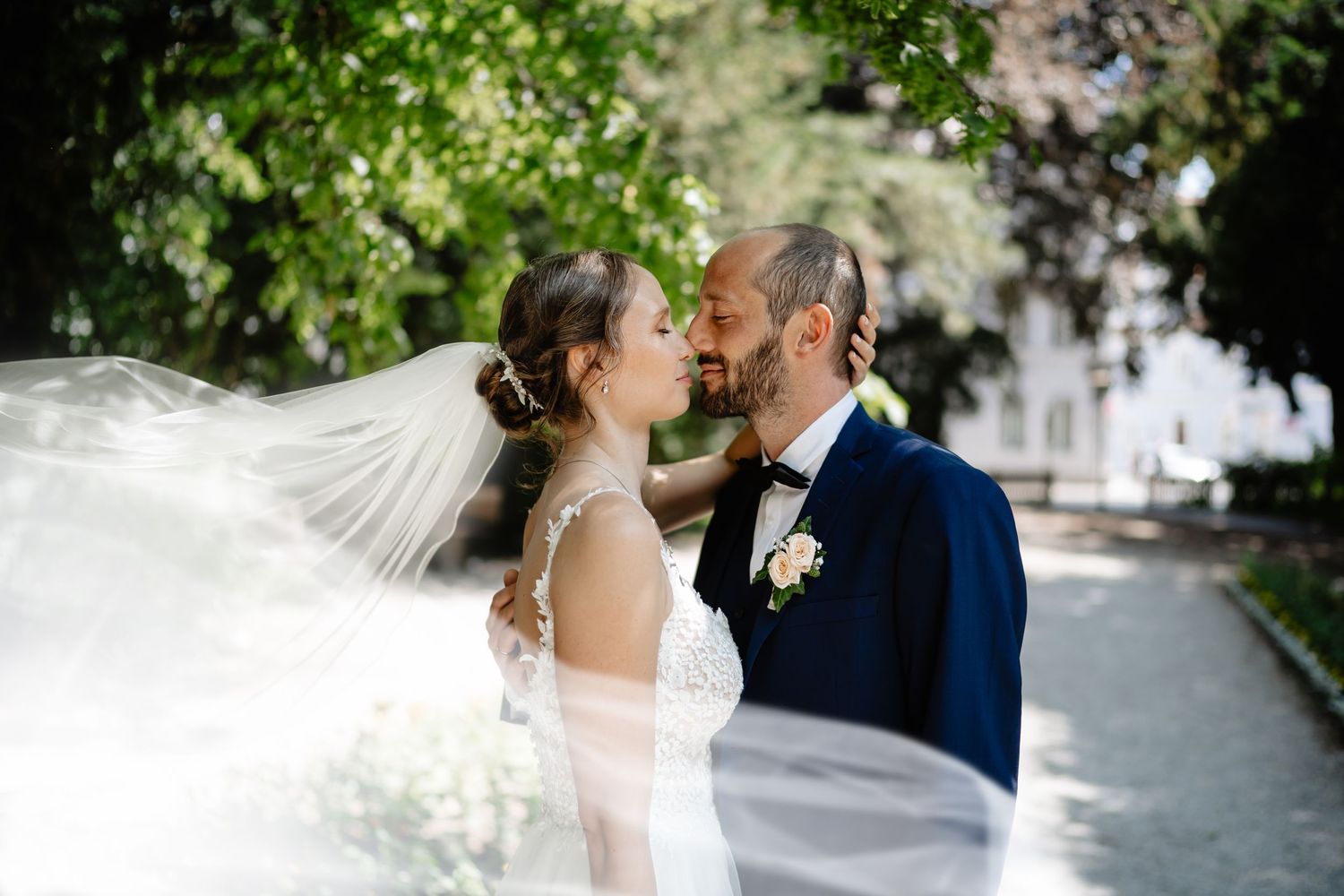 Romantic wedding moment captured in a lush garden setting with natural light.