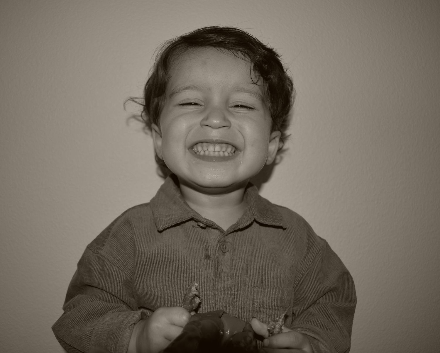 Series of black and white portraits showing expressive joy and laughter.