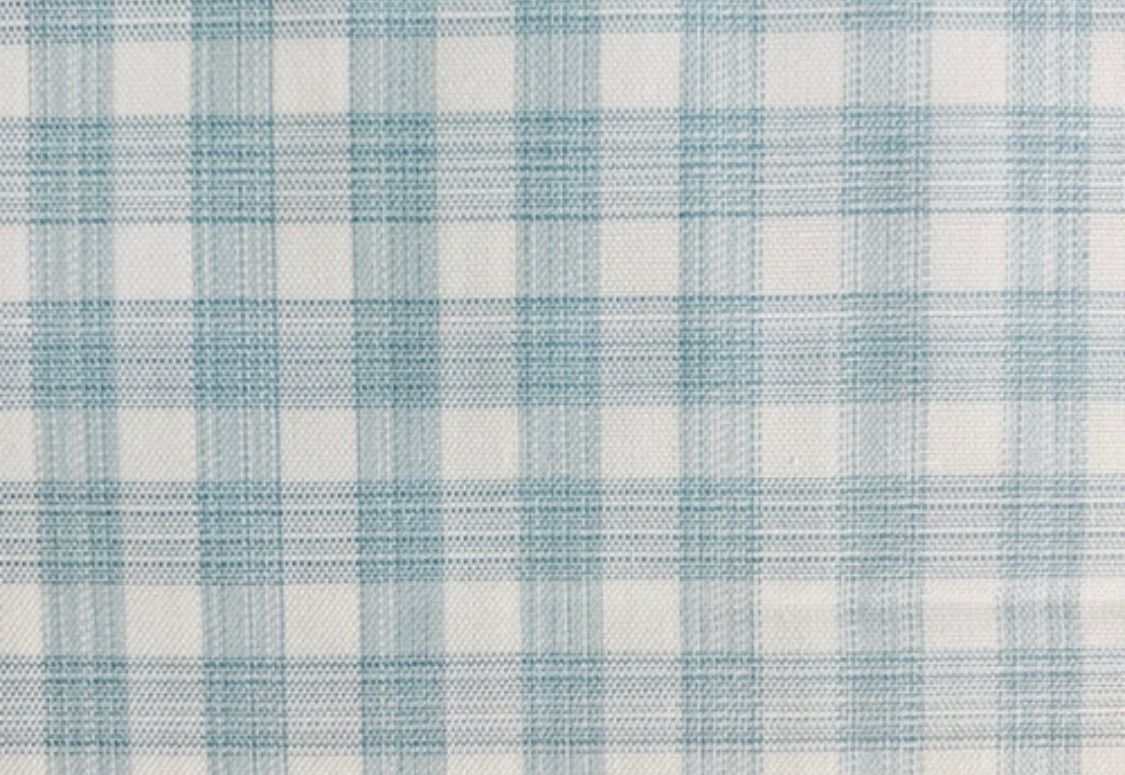 Light blue and white plaid pattern textile background with repeating squares.