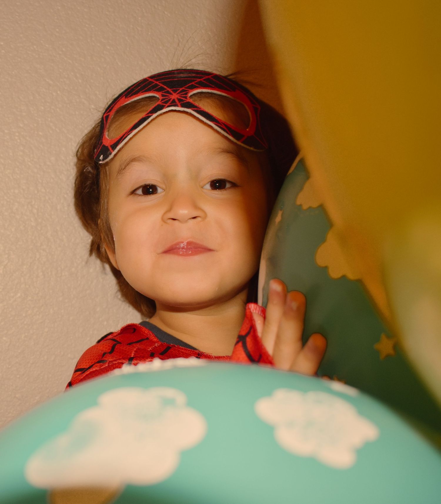 A teal balloon with cloud patterns decorates a celebration scene.