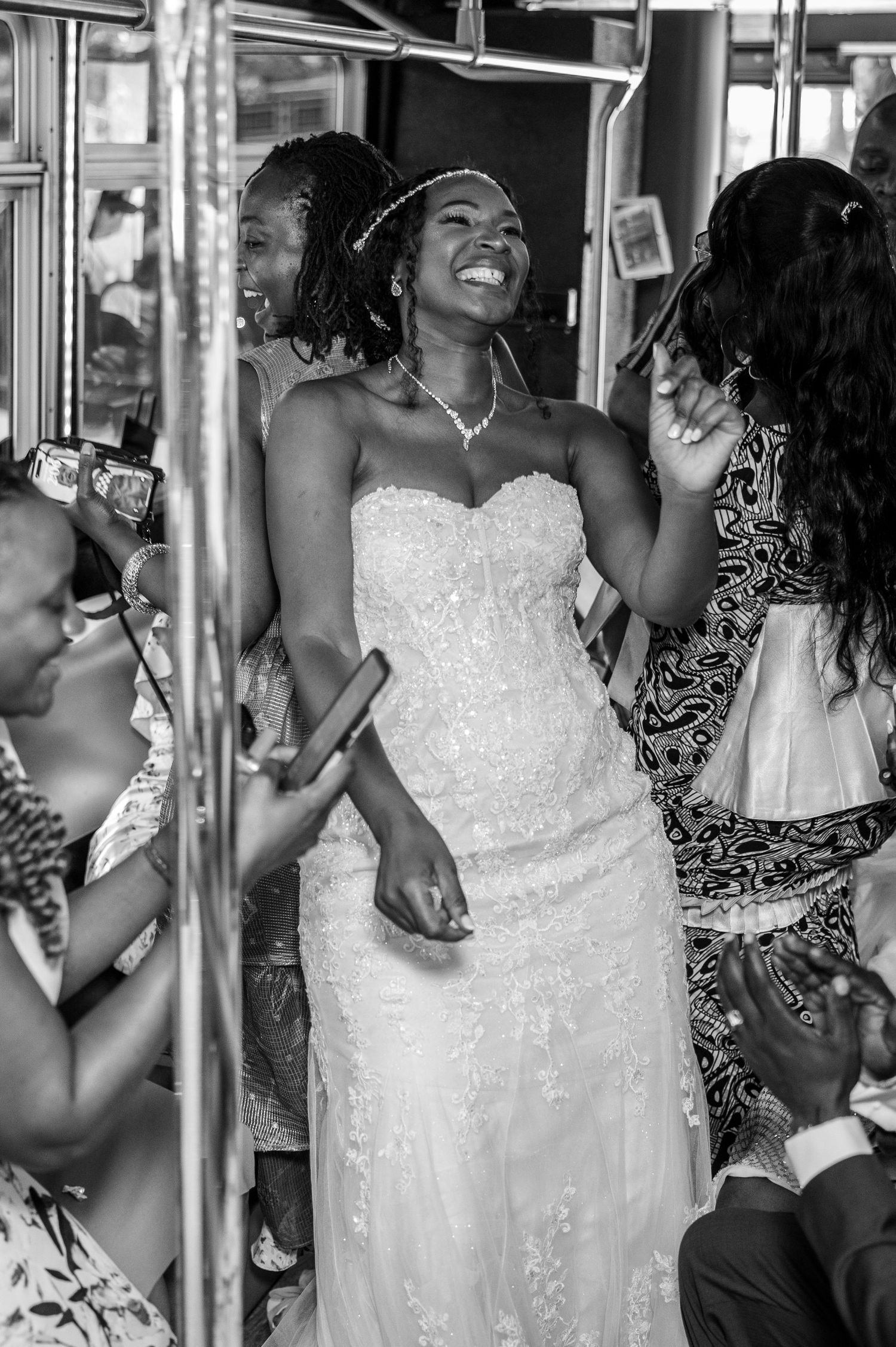 A radiant bride in a white strapless gown dances and celebrates at her wedding reception.