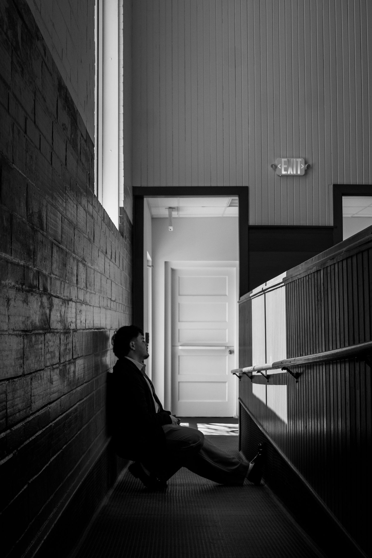 A series of black and white photographs showing a dark hallway with dramatic lighting and shadows.