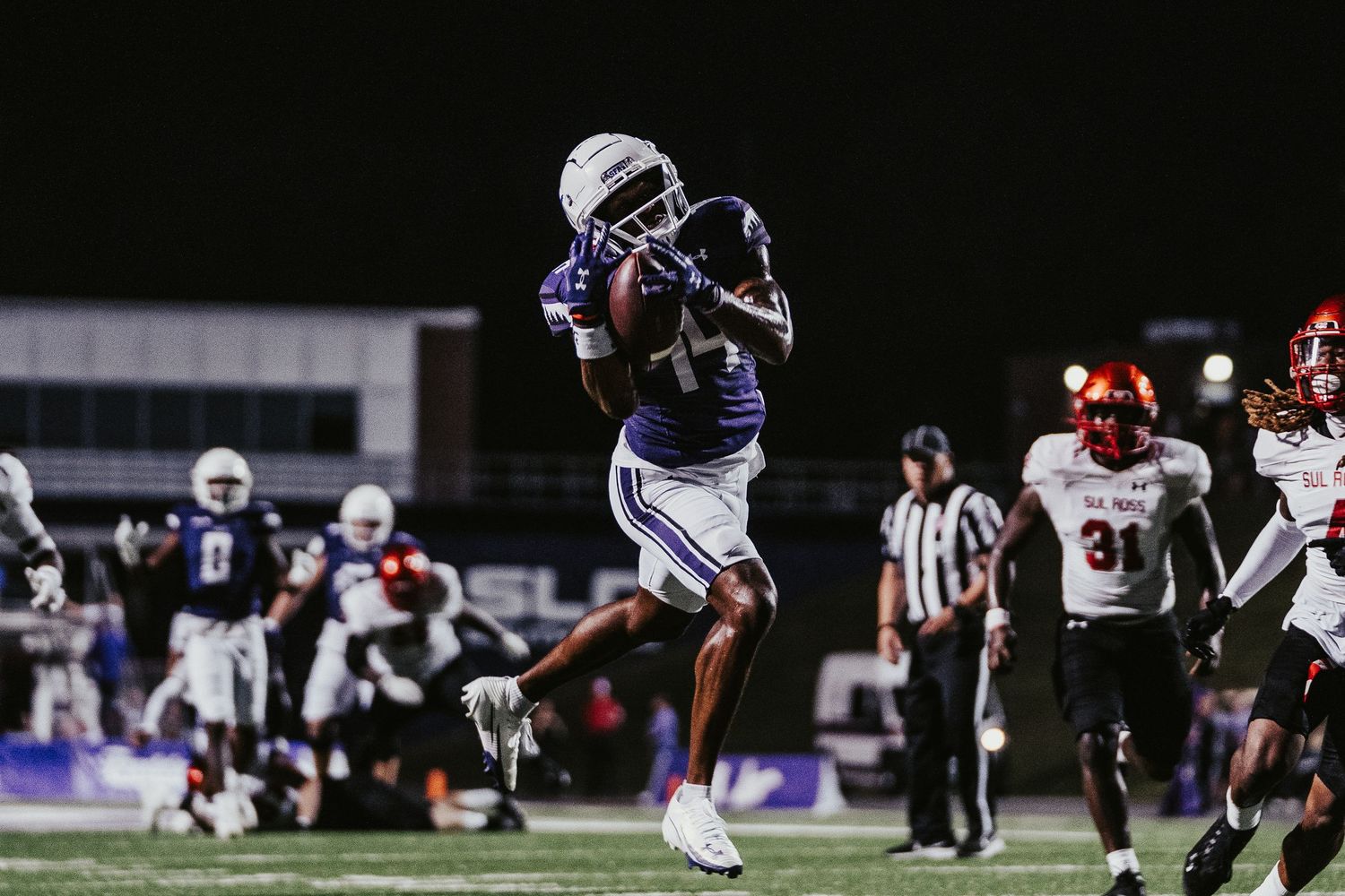 Football players compete in a nighttime game on an illuminated field with multiple action shots showing tackles and plays.