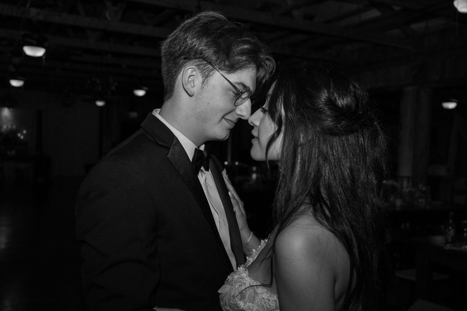Black and white candid moments from a formal evening event.