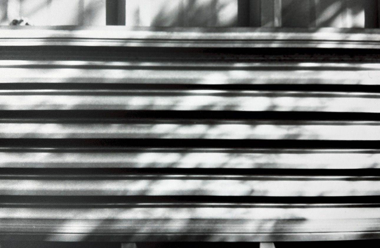 Black and white horizontal stripes create an abstract pattern with varying widths and contrasts.