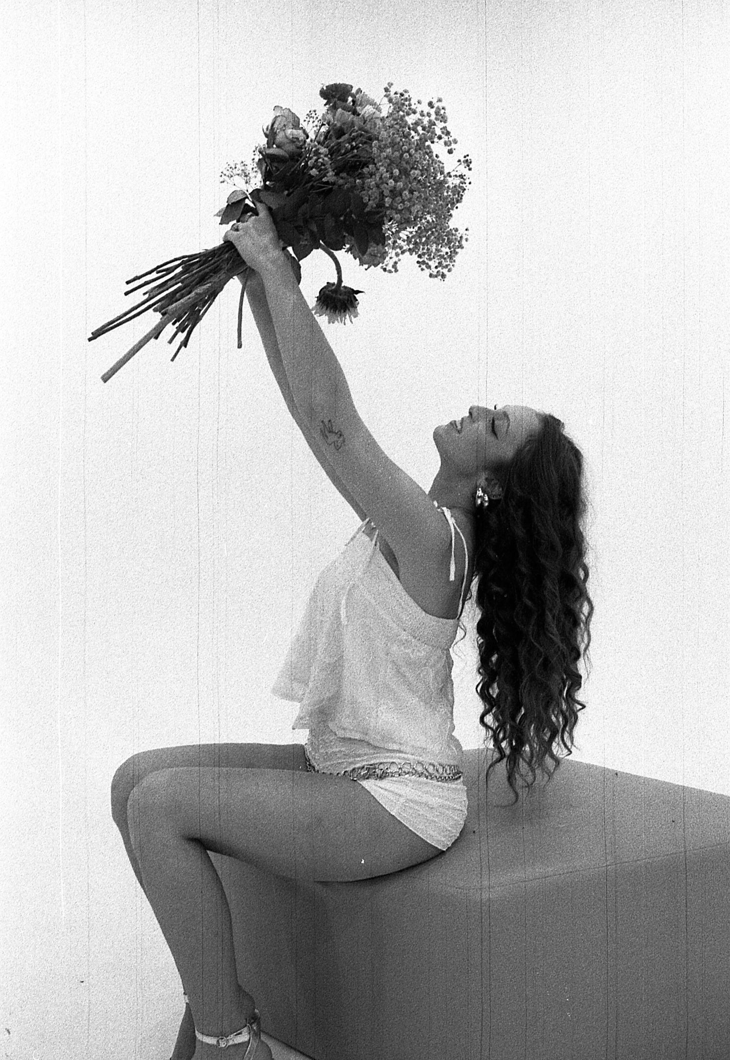 Black and white artistic photo series showing a dancer in expressive poses against a minimalist background.