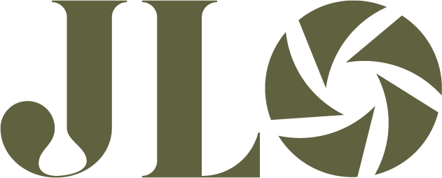 A minimalist logo design featuring stylized letters JL and a circular aperture or shutter icon in olive green color.