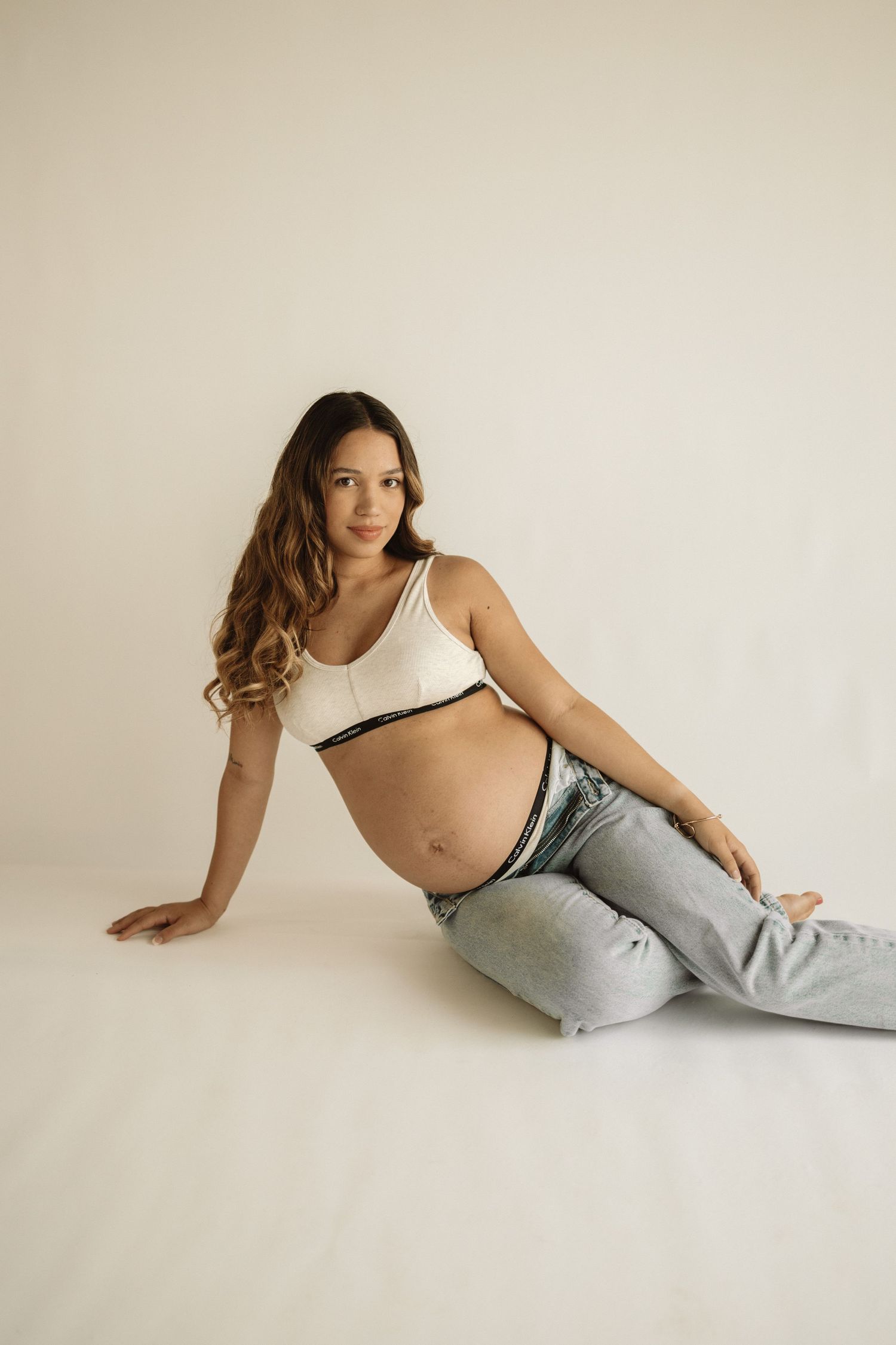 A sequence of relaxed poses against a minimalist white backdrop in casual loungewear.