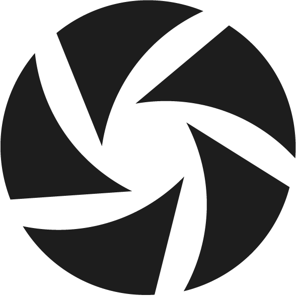 Black and white swirling circular logo design with curved geometric segments.