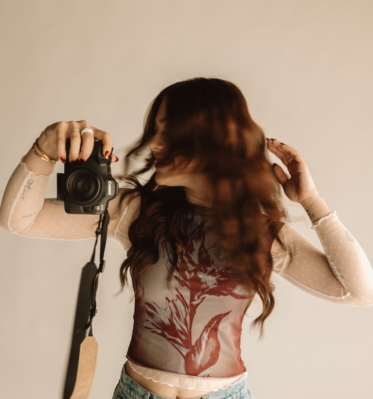 Close-up view of a large red dragon tattoo design on person wearing a white top.