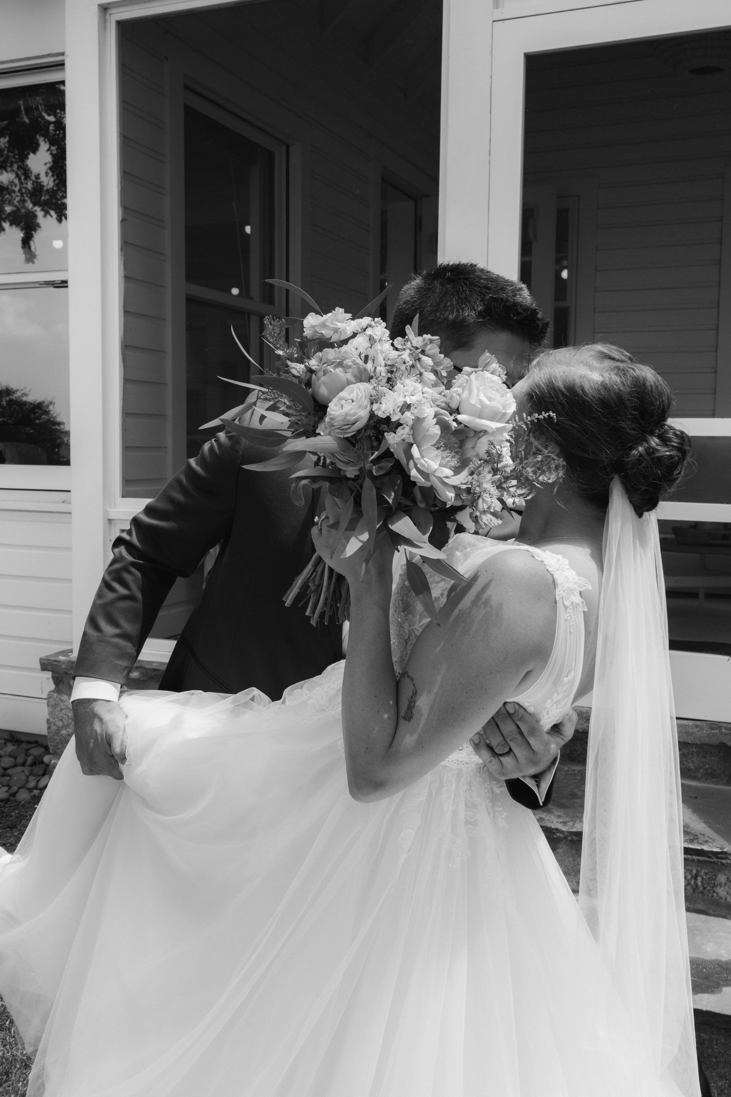A sequence of black and white photos showing bridesmaids in white dresses holding bouquets and posing in a row.